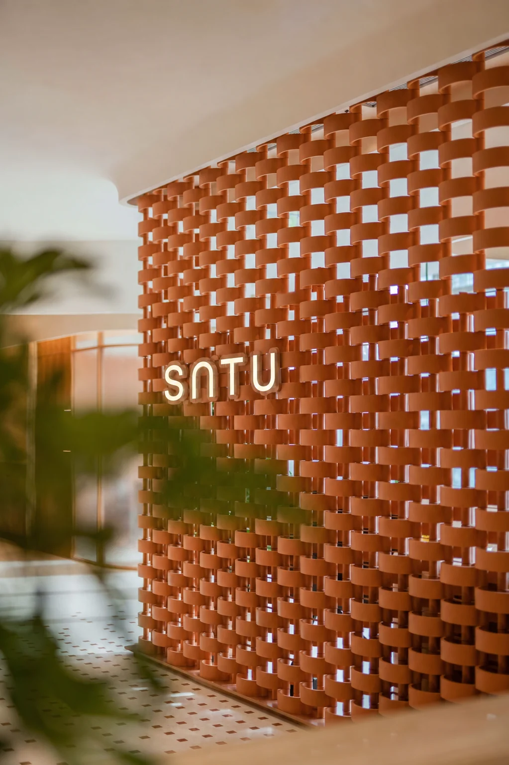 SATU studio feature wall with woven terracotta screen in Vietnam